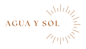 The logo for 'AGUA Y SOL' features the brand name in a warm terracotta serif font, accompanied by a minimalist sunburst graphic on a solid white background.